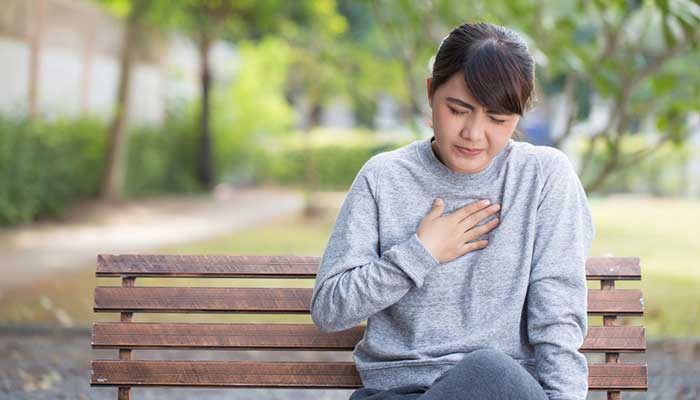 A young woman with heartburn